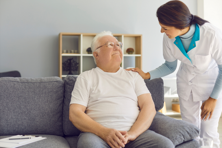 Client in Elderly Care being Helped by Trained Nursing Staff Member.