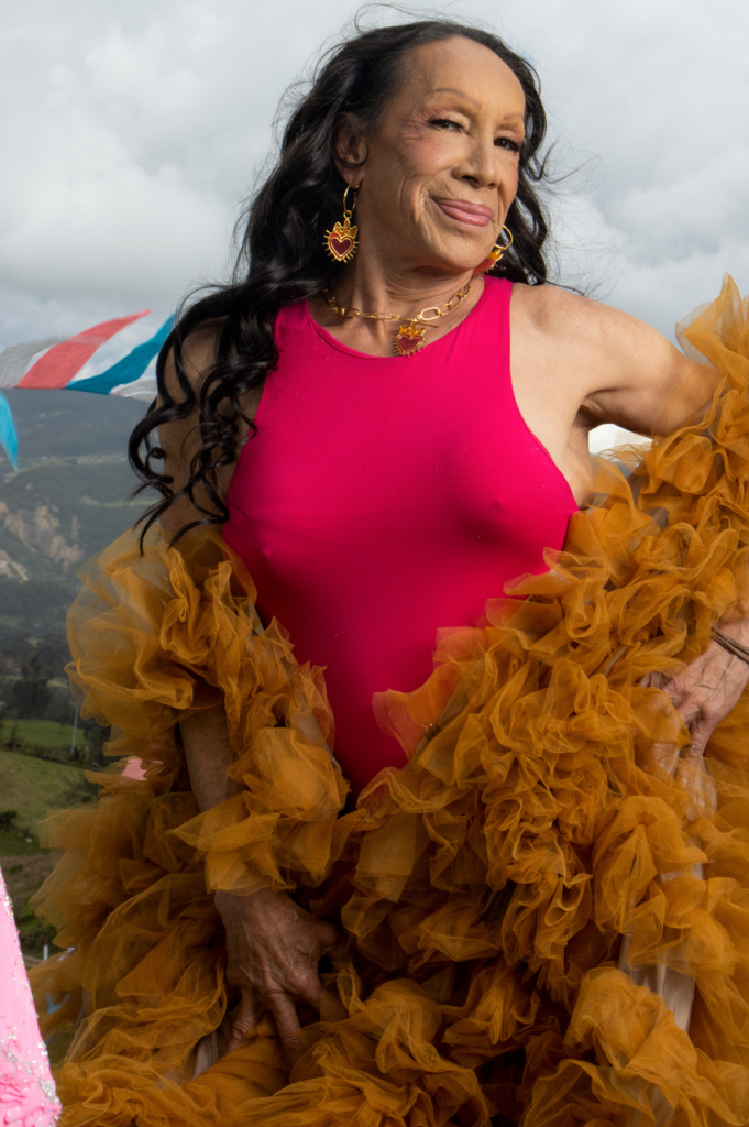 Elderly Woman Smiling in Daring Pink Dress