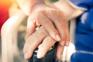 Close-up of Two Older Hands Touching Each Other