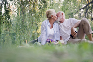 Older Couple Kissing in the Park