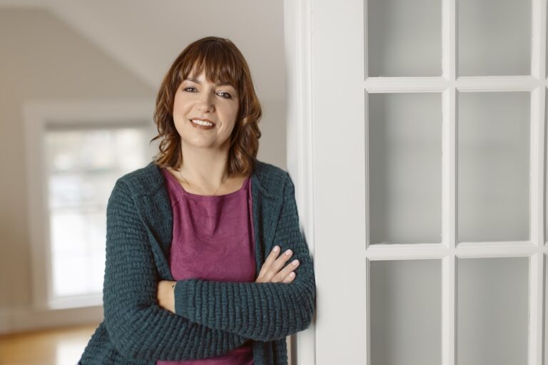 Dr. Nathalie Huitema standing at window.